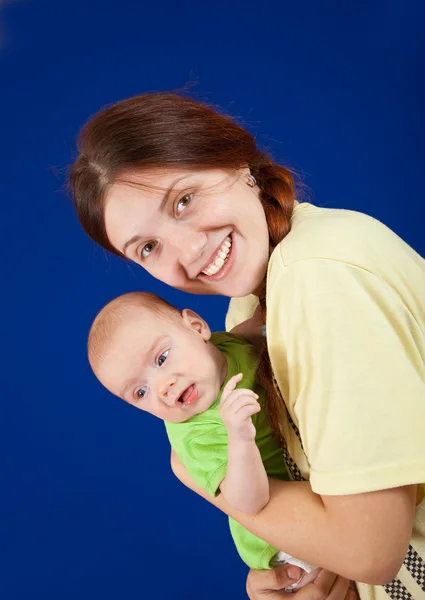 Mother holding young baby — Stock Photo, Image