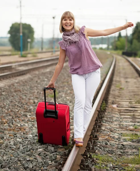Happy woman with luggage — Stock Photo, Image