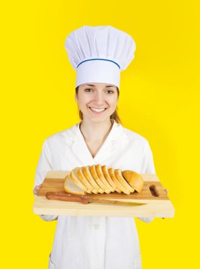 Cook holding bread on cutting board clipart