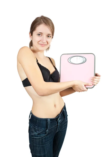 Девушка с весами в ванной — стоковое фото