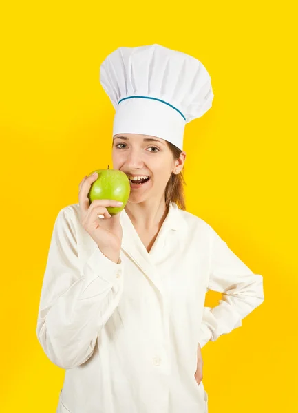 Chef con mela verde in mano — Foto Stock