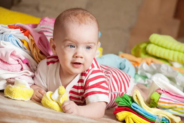 Baby girl with baby's clothes — Stock Photo, Image