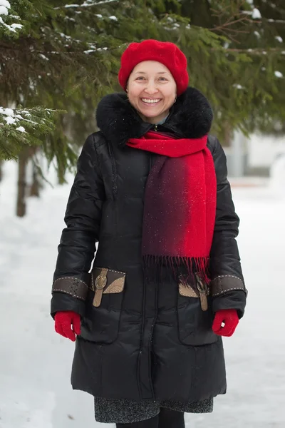Mature woman at winter park — Stok fotoğraf
