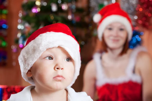 Little boy in Christmas hat Stock Picture