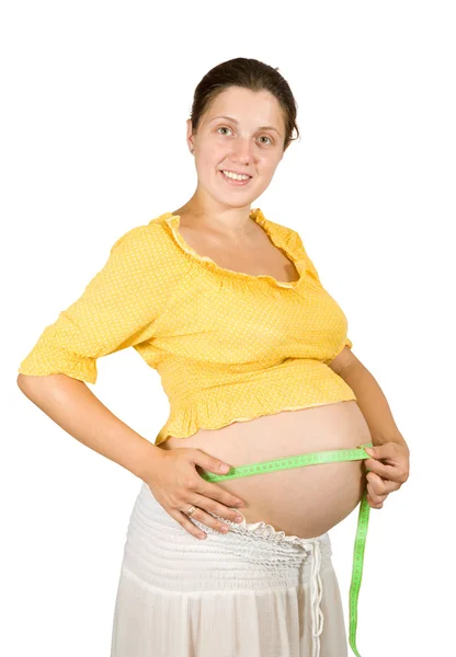 Szczęśliwa kobieta w ciąży brzuch pomiarowe — Zdjęcie stockowe