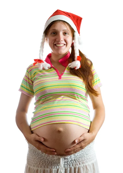 Беременная женщина в шляпе Санты — стоковое фото
