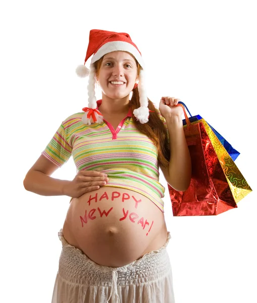Беременная женщина с рождественскими подарками — стоковое фото