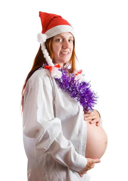 Zwangere vrouw in Kerstman hoed — Stockfoto