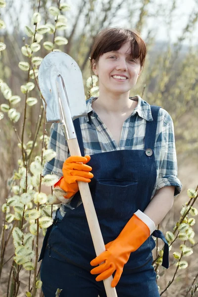 Happy woman with shovel — Stock Photo, Image