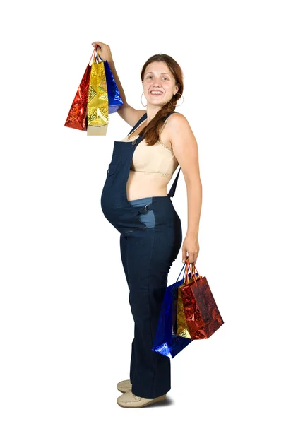 Mulher grávida segurando sacos de compras — Fotografia de Stock