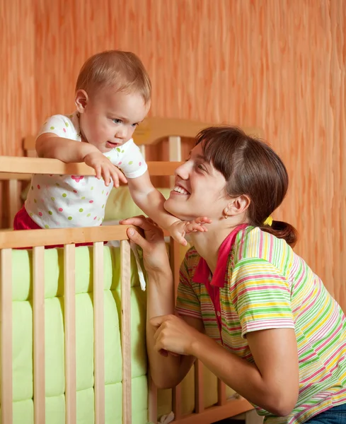 Happy mother plays with baby — Stock Photo, Image