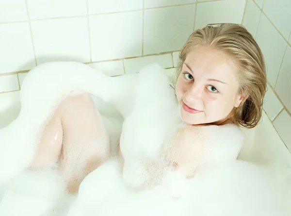 Girl sitting in a bath — Stock Photo, Image