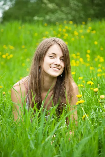 Teen girl is lying at meadow — Stock Photo, Image
