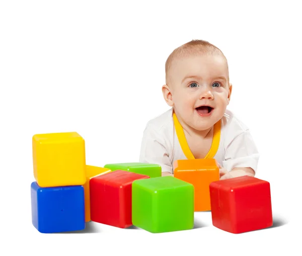 Happy baby plays with toy blocks — Stock Photo, Image