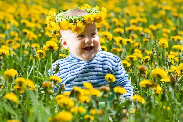 Little baby in flowers chaplet — Stock Photo, Image