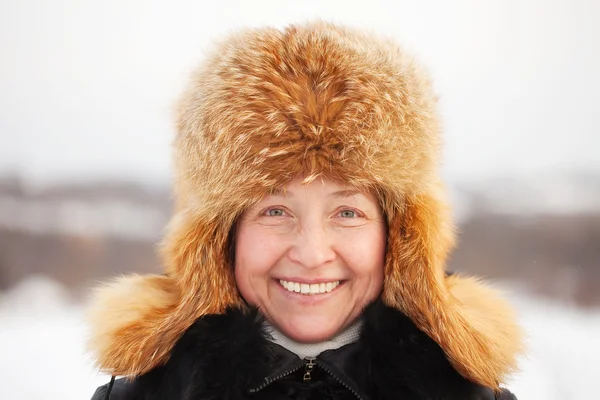 Mature woman in wintry clothes — Stock Photo, Image