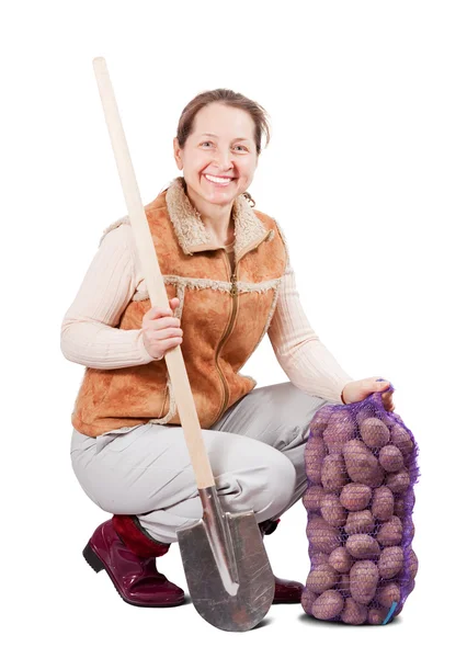 Happy farmer with harvested potatoes — Stock Photo, Image
