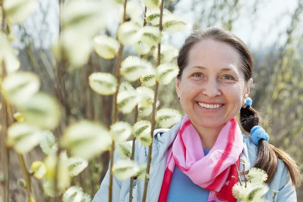 Smiling senior woman in spring — Stock Photo, Image