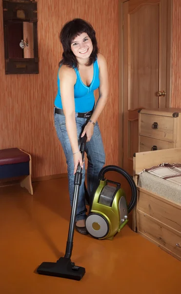 Girl cleans with vacuum cleaner — Stock Photo, Image