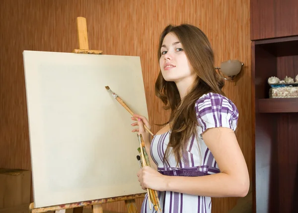 Young painter near easel — Stock Photo, Image