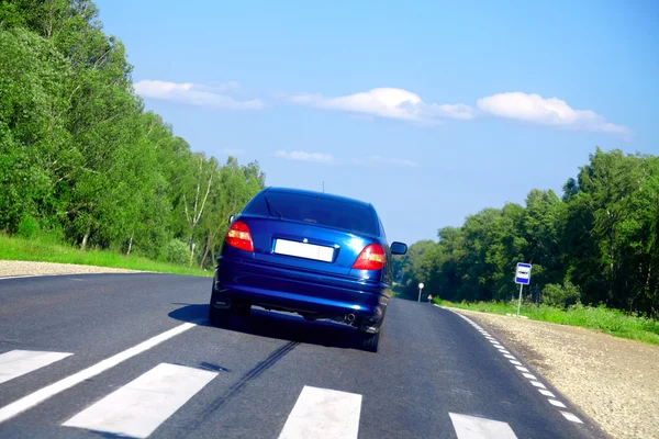 Blue car on the road — Stock Photo, Image