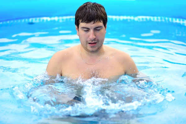 stock image Young wet man relax in the swimming pool