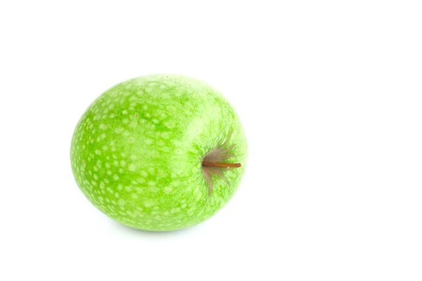 Manzana verde aislada manchada sobre un fondo blanco — Foto de Stock