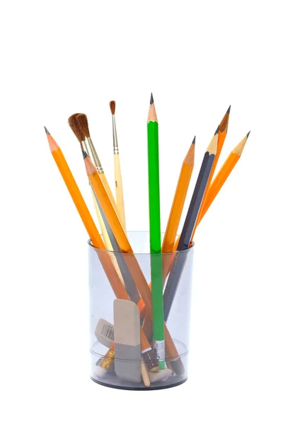 Lápis e escovas em um copo cinza — Fotografia de Stock
