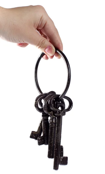 A mão estende velhas chaves — Fotografia de Stock