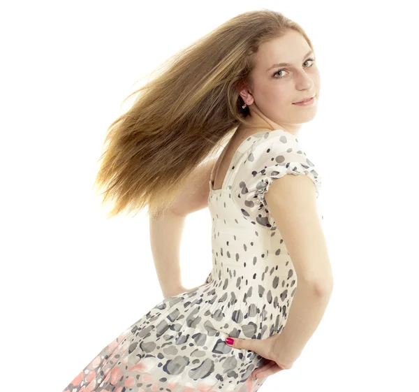 A menina com um cabelo voador em um fundo branco — Fotografia de Stock
