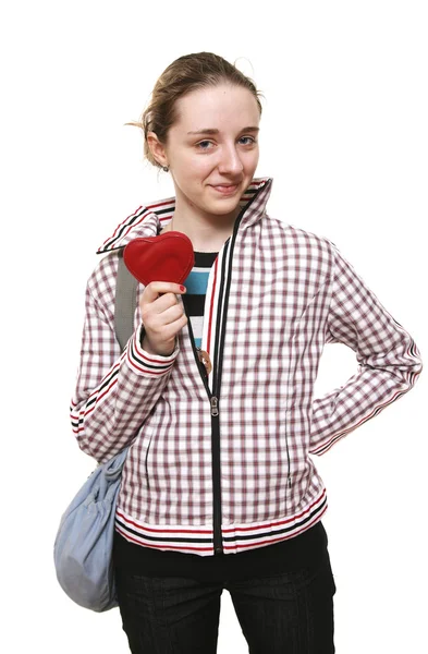 Girl stands with symbol of heart in hand — Stock Photo, Image