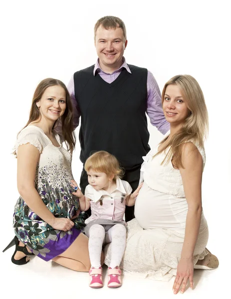 Malá skupina, dvě těhotné ženy, dítěte a muž — Stock fotografie