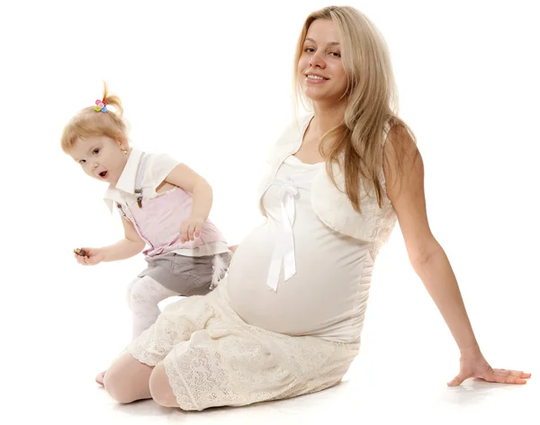 Portrait of the beautiful pregnant woman with the surprised girl — Stock Photo, Image