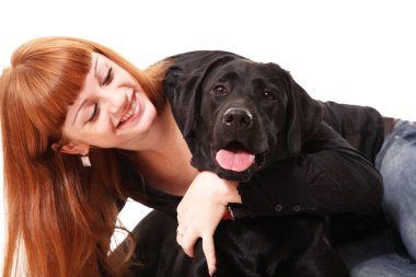 The young woman hugging a mix breed dog clipart