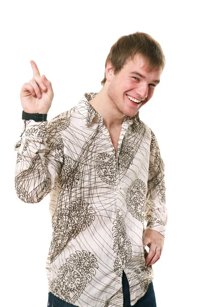 Young man maliciously smiles points a finger in top — Stock Photo, Image