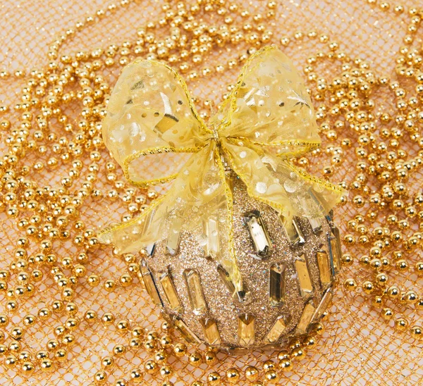 Christmas ball with bow and beads — Stock Photo, Image