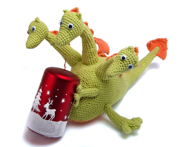 Knitted dragon with christmas candle — Stock Photo, Image
