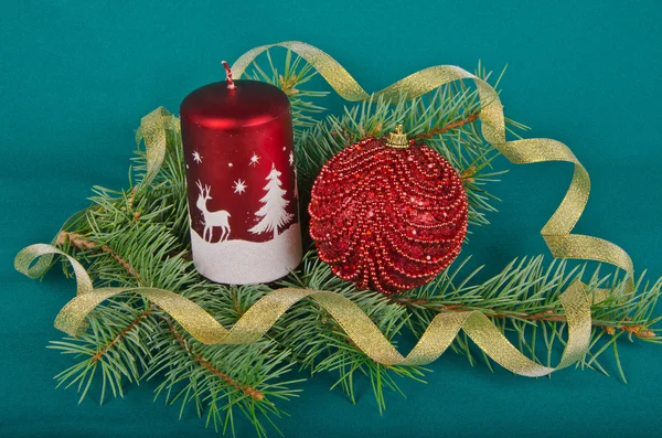 Christmas decorations with candle and spruce — Stock Photo, Image