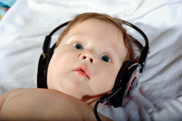 stock image Portrait of beautiful baby with headphones
