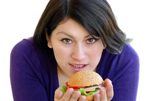 Yound happy smiling woman eating sandwich — Stock Photo, Image