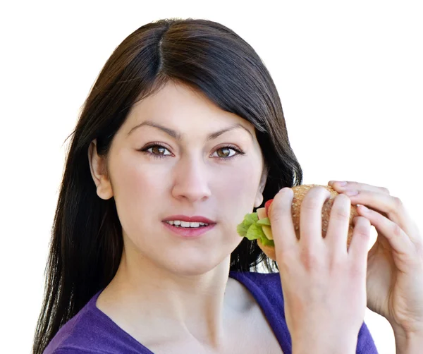 Mujer comiendo sándwich, aislado sobre fondo blanco — Foto de Stock