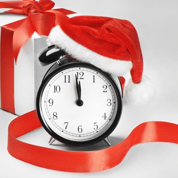 Alarm clock with Santa hat — Stock Photo, Image