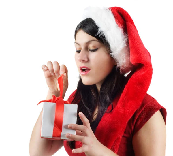 Young woman in Santa hat with gift — Stock Photo, Image