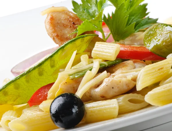 Penne with vegetables and meat — Stock Photo, Image