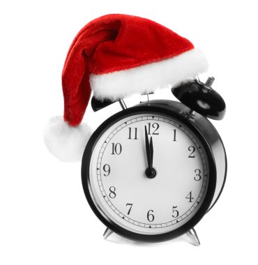 Alarm clock with Santa hat isolated on white