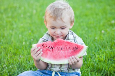 Boy eating watermelon