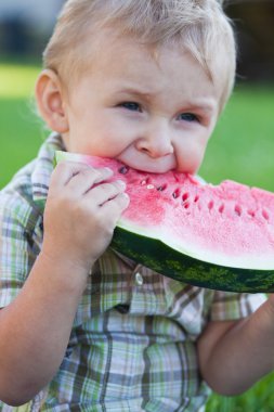 Boy eating watermelon