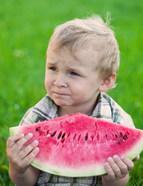 Boy eating watermelon