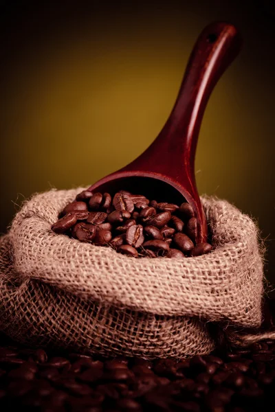 Coffee beans spilling — Stock Photo, Image