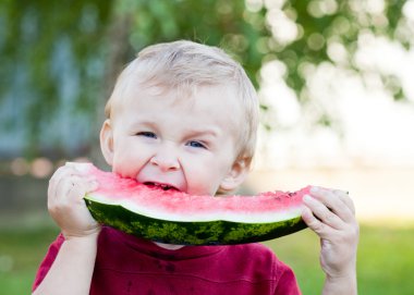 Boy eating watermelon